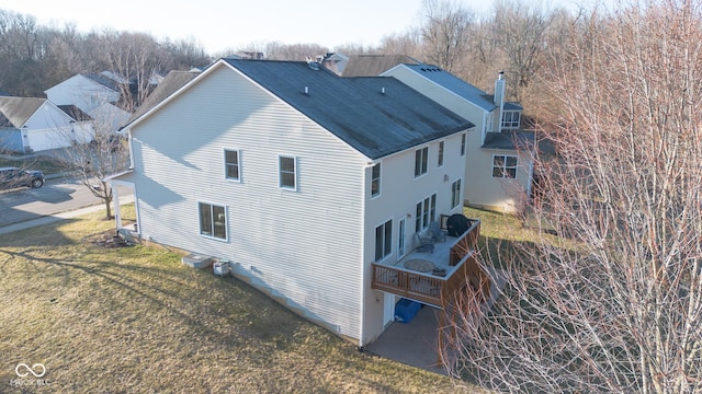 226 S Cave Creek Dr S, Bloomington, IN 47403 - view of home's exterior with a chimney, a deck, and roof with shingles
