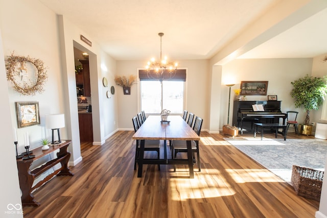226 S Cave Creek Dr S, Bloomington, IN 47403 - dining space with a chandelier, wood finished floors, and baseboards