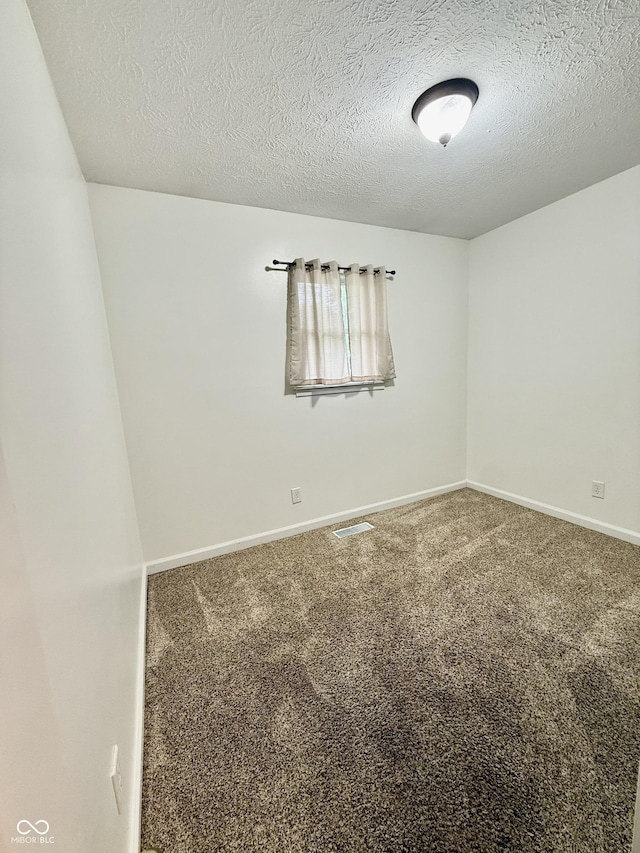 1002 Meadow Ln, Greencastle, IN 46135 - spare room with carpet, a textured ceiling, and baseboards