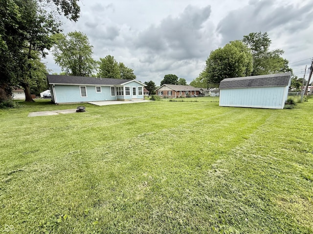 1002 Meadow Ln, Greencastle, IN 46135 - view of green lawn featuring a patio area
