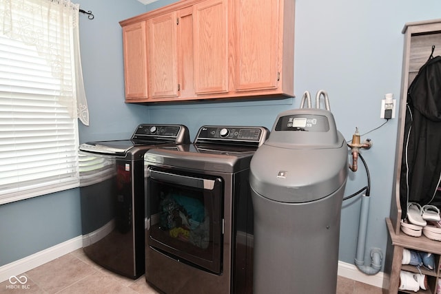 1744 Salina Dr, Avon, IN 46123 - laundry area with cabinet space, washer and clothes dryer, and light tile patterned floors