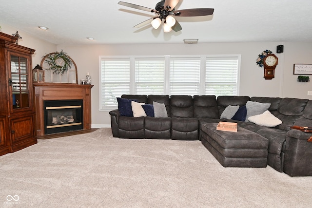 1744 Salina Dr, Avon, IN 46123 - living area with carpet floors, a ceiling fan, healthy amount of natural light, and a fireplace with flush hearth