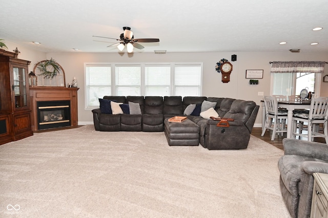 1744 Salina Dr, Avon, IN 46123 - living area featuring a ceiling fan, healthy amount of natural light, recessed lighting, and a fireplace with flush hearth
