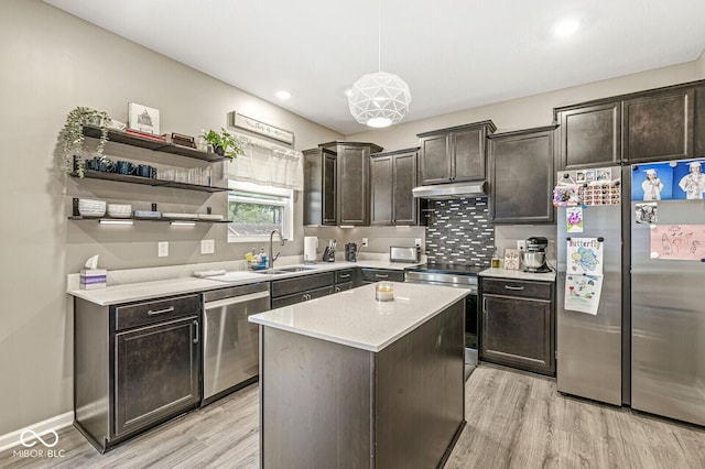 126 Winding Brook Way, Pendleton, IN 46064 - kitchen with stainless steel appliances, a sink, under cabinet range hood, light wood-type flooring, and dark brown cabinetry