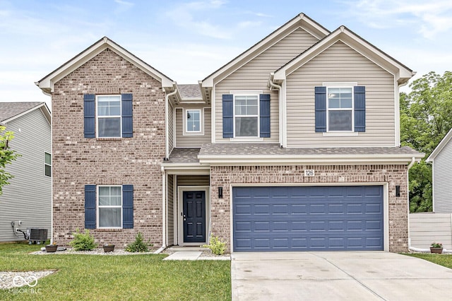 126 Winding Brook Way, Pendleton, IN 46064 - view of front facade featuring brick siding, concrete driveway, a front lawn, and an attached garage