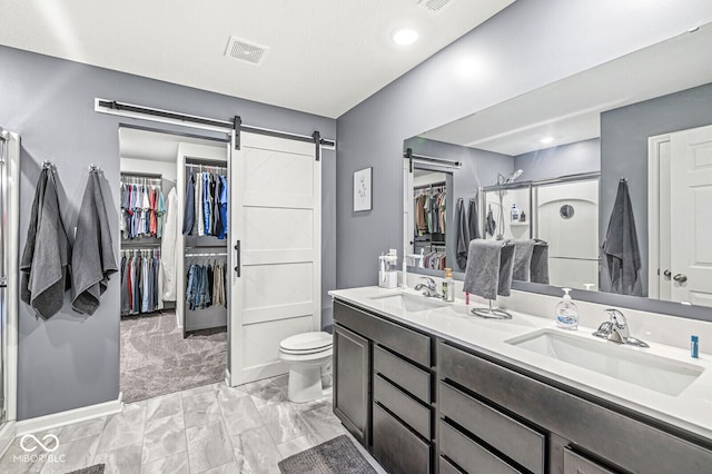 126 Winding Brook Way, Pendleton, IN 46064 - full bath with a walk in closet, double vanity, a stall shower, toilet, and marble finish floors