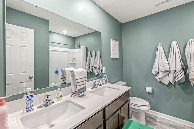 126 Winding Brook Way, Pendleton, IN 46064 - bathroom with toilet, double vanity, a shower, marble look tiles, and baseboards