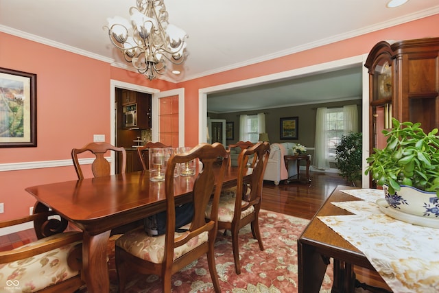 9550 E State Road 46, Bloomington, IN 47401 - dining room featuring a chandelier, wood finished floors, ornamental molding, and baseboards