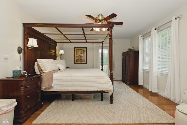 9550 E State Road 46, Bloomington, IN 47401 - bedroom with multiple windows, wood finished floors, and baseboards