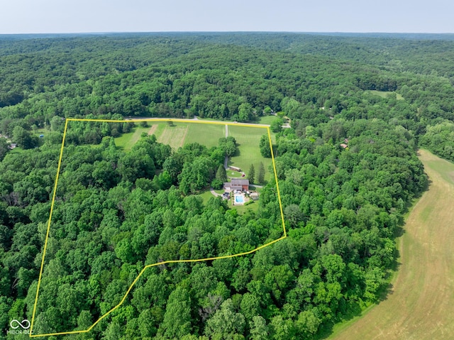 9550 E State Road 46, Bloomington, IN 47401 - aerial view of property and surrounding area featuring a forest and property parcel outlined