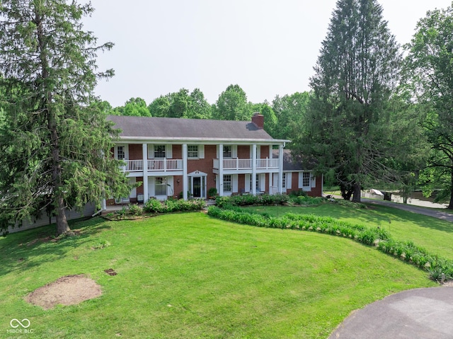 9550 E State Road 46, Bloomington, IN 47401 - greek revival house with a balcony, a chimney, a front lawn, and brick siding