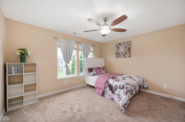 1143 Hampton Dr, Greenwood, IN 46143 - bedroom featuring carpet floors and a ceiling fan