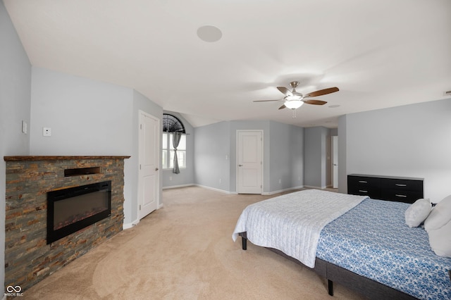 1143 Hampton Dr, Greenwood, IN 46143 - bedroom with light carpet, a stone fireplace, and ceiling fan