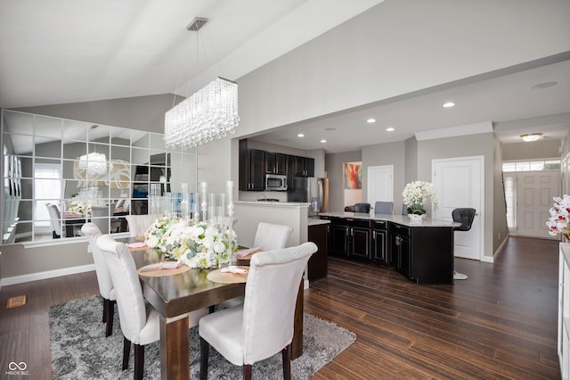 1143 Hampton Dr, Greenwood, IN 46143 - dining room with a chandelier, dark wood-type flooring, recessed lighting, and vaulted ceiling