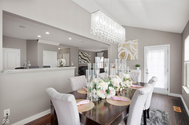 1143 Hampton Dr, Greenwood, IN 46143 - dining area with a chandelier, dark wood-style flooring, recessed lighting, and lofted ceiling