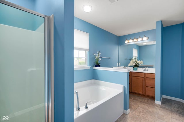 1143 Hampton Dr, Greenwood, IN 46143 - full bathroom with double vanity, a bath, a stall shower, and stone finish flooring