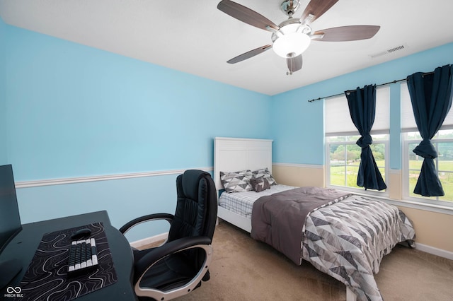 1143 Hampton Dr, Greenwood, IN 46143 - bedroom with carpet, a ceiling fan, and a desk