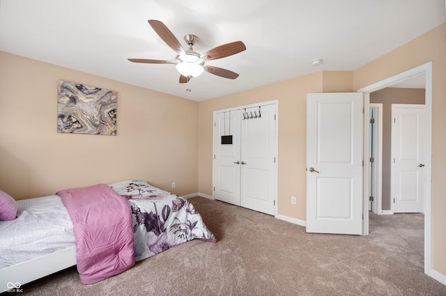 1143 Hampton Dr, Greenwood, IN 46143 - carpeted bedroom featuring a closet and a ceiling fan