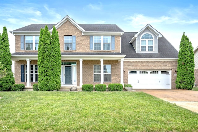 1143 Hampton Dr, Greenwood, IN 46143 - view of front of home featuring driveway, brick siding, and a front lawn