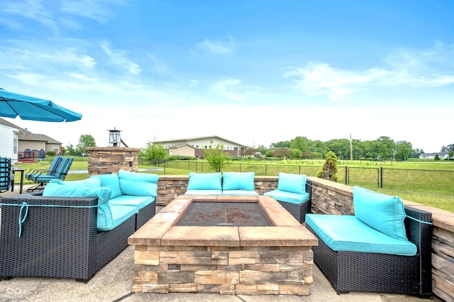 1143 Hampton Dr, Greenwood, IN 46143 - view of patio with an outdoor living space with a fire pit