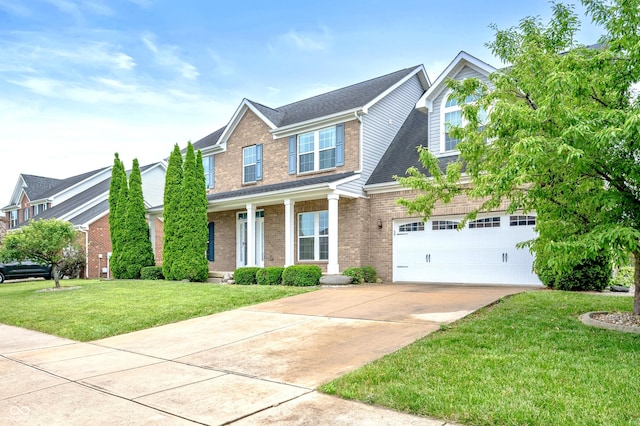 1143 Hampton Dr, Greenwood, IN 46143 - traditional-style home with driveway, brick siding, a porch, a front lawn, and a garage