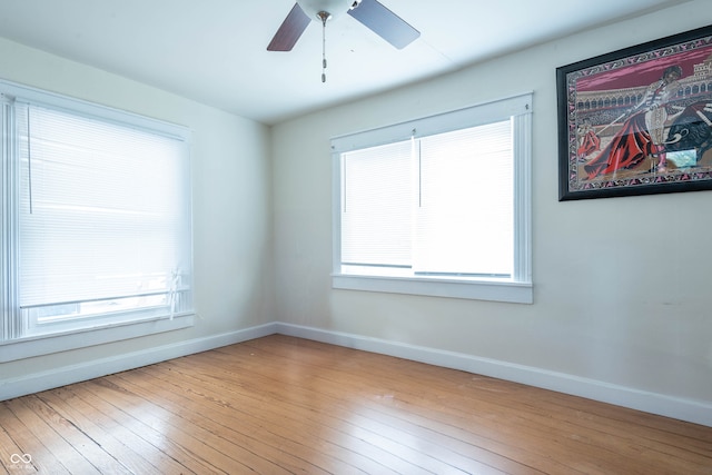 308 S Madison St, Bloomington, IN 47403 - spare room with baseboards, ceiling fan, and hardwood / wood-style flooring