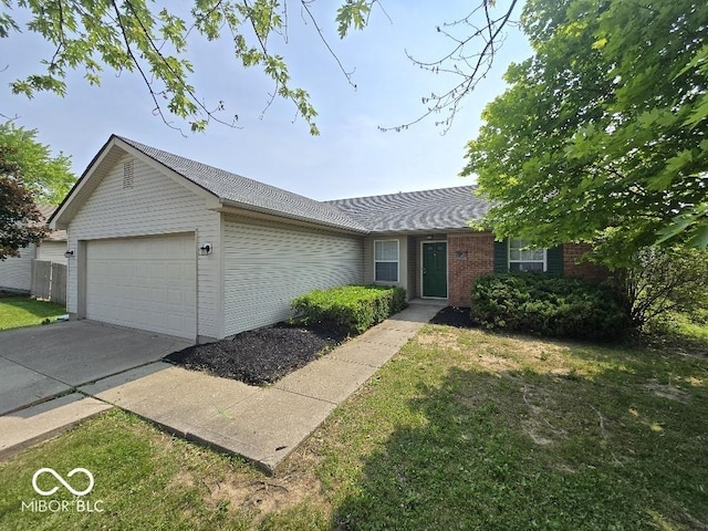 5825 Sapelo Dr, Indianapolis, IN 46237 - ranch-style home featuring an attached garage and a front yard