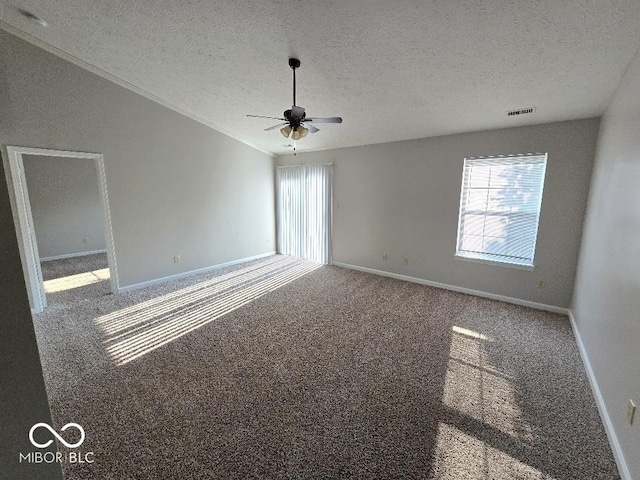 5825 Sapelo Dr, Indianapolis, IN 46237 - carpeted empty room with a textured ceiling, ceiling fan, baseboards, and crown molding