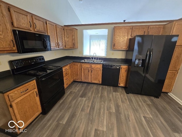 5825 Sapelo Dr, Indianapolis, IN 46237 - kitchen with black appliances, dark countertops, a sink, dark wood-style flooring, and brown cabinets