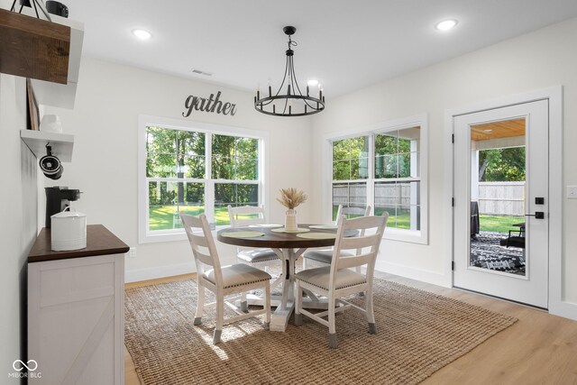 3365 Riverside Dr, Columbus, IN 47203 - dining room featuring a chandelier, light wood-type flooring, baseboards, and recessed lighting