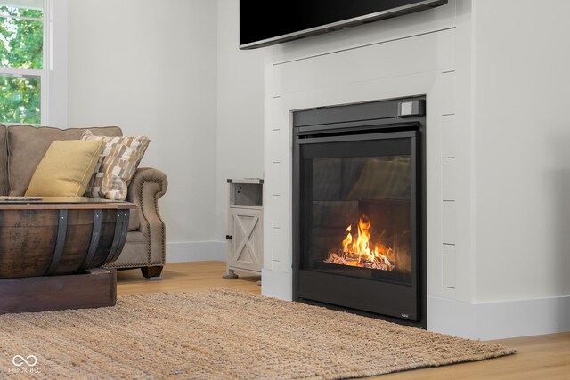 3365 Riverside Dr, Columbus, IN 47203 - detailed view of a glass covered fireplace and wood finished floors