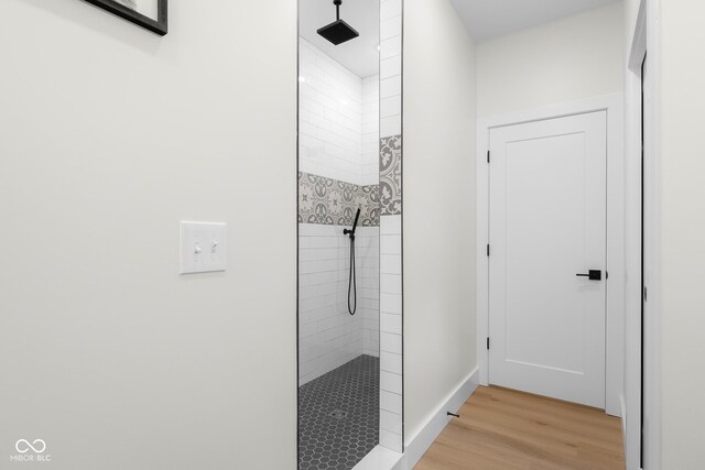 3365 Riverside Dr, Columbus, IN 47203 - bathroom with walk in shower, wood finished floors, and baseboards