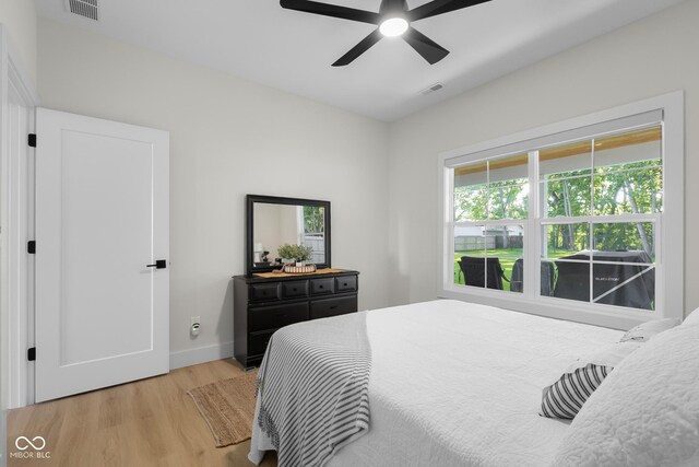 3365 Riverside Dr, Columbus, IN 47203 - bedroom featuring light wood-style floors, baseboards, and ceiling fan