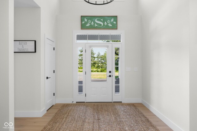 3365 Riverside Dr, Columbus, IN 47203 - foyer entrance with light wood finished floors and baseboards