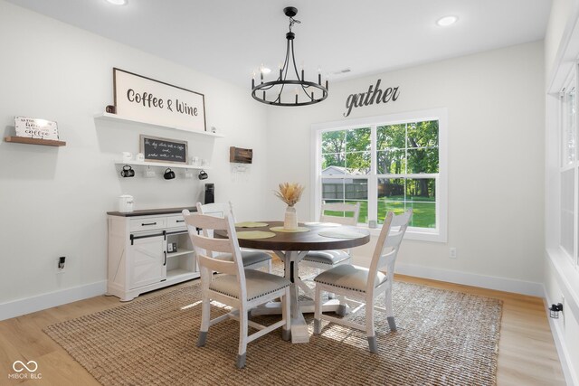 3365 Riverside Dr, Columbus, IN 47203 - dining room with a chandelier, light wood finished floors, baseboards, recessed lighting, and a dry bar