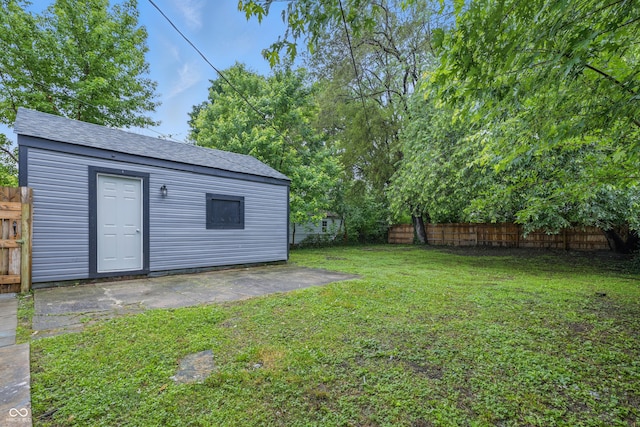 2720 S Taft Ave, Indianapolis, IN 46241 - fenced backyard featuring a patio area and an outbuilding