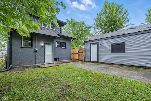 2720 S Taft Ave, Indianapolis, IN 46241 - rear view of house with roof with shingles and stucco siding