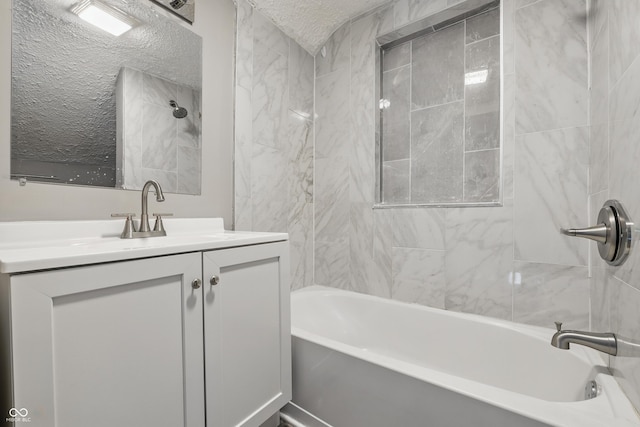 2720 S Taft Ave, Indianapolis, IN 46241 - bathroom with tub / shower combination, vanity, and a textured ceiling