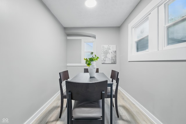 2720 S Taft Ave, Indianapolis, IN 46241 - dining space with light wood-style flooring and arched walkways