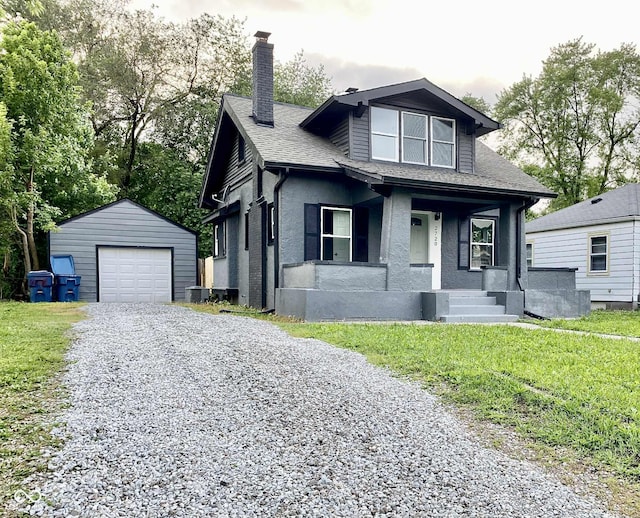 2720 S Taft Ave, Indianapolis, IN 46241 - bungalow featuring a chimney, an outdoor structure, a porch, driveway, and a garage