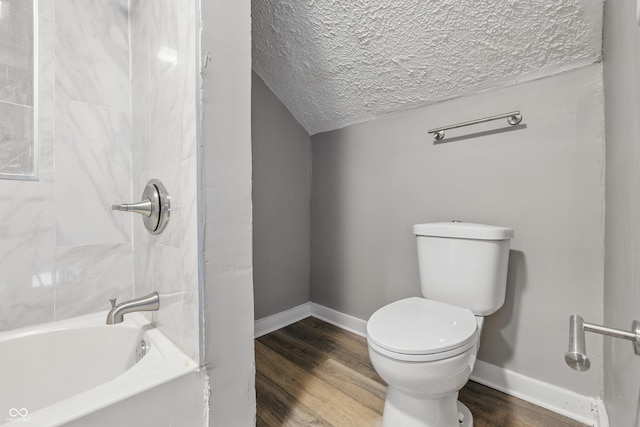 2720 S Taft Ave, Indianapolis, IN 46241 - bathroom featuring a textured ceiling, wood finished floors, and shower / bath combination