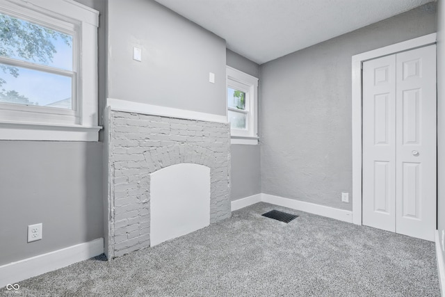 2720 S Taft Ave, Indianapolis, IN 46241 - unfurnished living room featuring carpet flooring and a fireplace