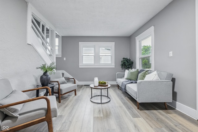 2720 S Taft Ave, Indianapolis, IN 46241 - living area featuring light wood-style flooring and a textured ceiling