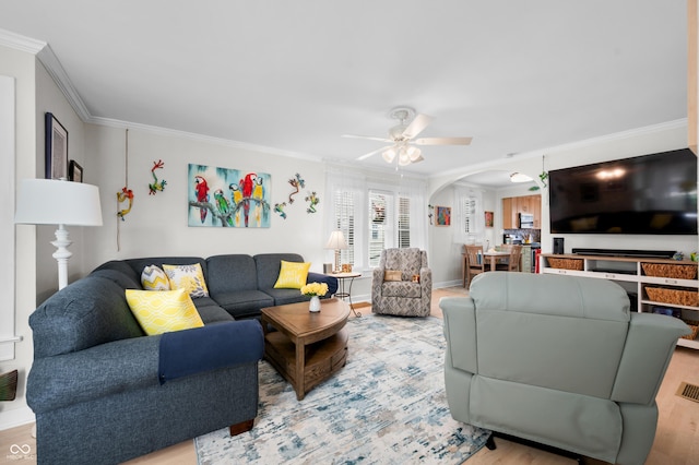 188 Maple Ln, Franklin, IN 46131 - living area featuring ornamental molding, a ceiling fan, arched walkways, and light wood-style flooring