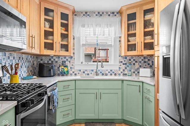 188 Maple Ln, Franklin, IN 46131 - kitchen with stainless steel appliances, a sink, light countertops, and tasteful backsplash