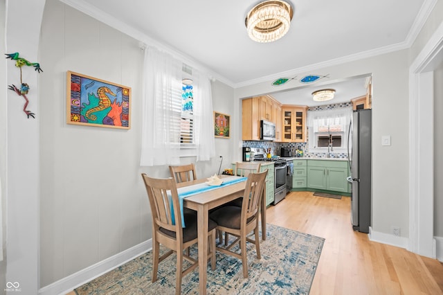 188 Maple Ln, Franklin, IN 46131 - dining area featuring light wood-type flooring, ornamental molding, and baseboards
