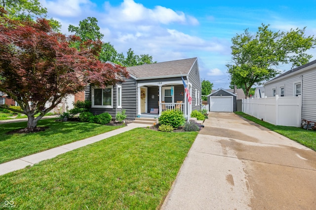 188 Maple Ln, Franklin, IN 46131 - view of front of property with driveway, an outbuilding, a porch, roof with shingles, and a detached garage