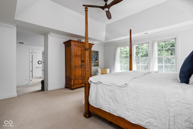 4529 Panthera Leo Dr, Carmel, IN 46074 - bedroom with light carpet, a tray ceiling, and ceiling fan