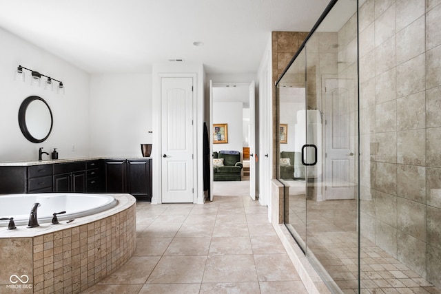 4529 Panthera Leo Dr, Carmel, IN 46074 - full bathroom featuring a shower stall, ensuite bathroom, vanity, tile patterned flooring, and a bath