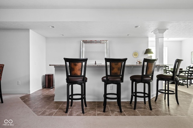 4529 Panthera Leo Dr, Carmel, IN 46074 - indoor bar featuring dark tile patterned flooring and recessed lighting